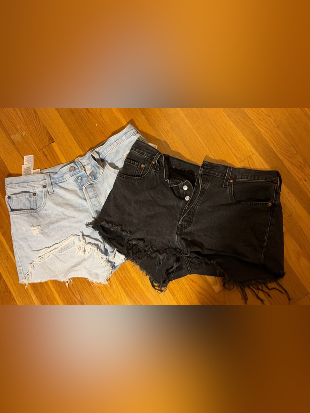 2 Pairs of Levi's Women's Distressed Light Blue and Black Denim Jean Shorts
